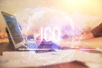 Double exposure of woman hands typing on computer and crypto market theme hologram drawing....