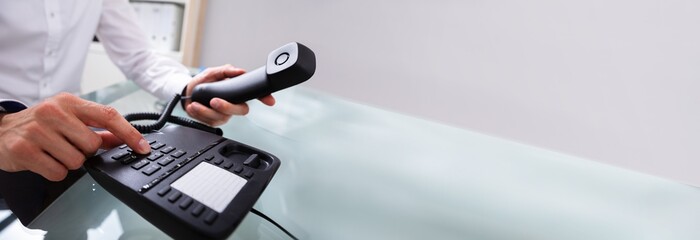 Businessman Calling On Landline