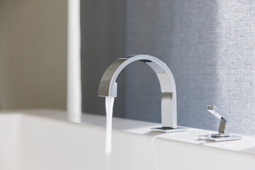 Water emitting from modern faucet
