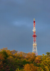 Obraz premium radio tower on a hill on evening sky background