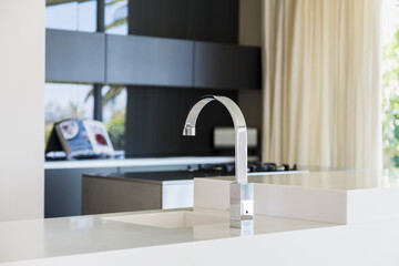 Faucet and sink in modern kitchen