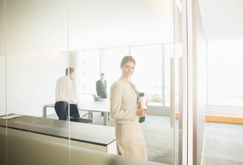Fototapeta premium Businesswoman smiling in office