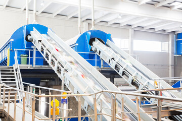 Conveyor belts in recycling center - obrazy, fototapety, plakaty