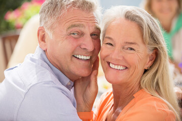 Senior couple smiling outdoors