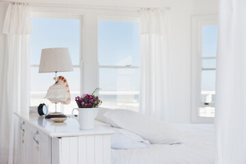 Shell lamp in bedroom overlooking ocean
