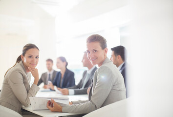 Obraz premium Portrait of confident businesswomen in conference room