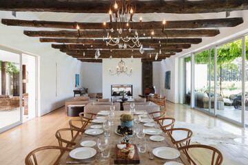 Chandelier over dining table in luxury house