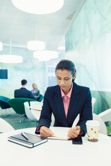Businesswoman reading in cafe