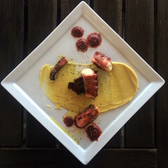 Octopus and mashed potatoes. Moden cuisine.