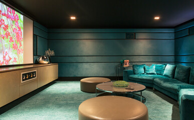 Sofa and tables in home movie theater - obrazy, fototapety, plakaty