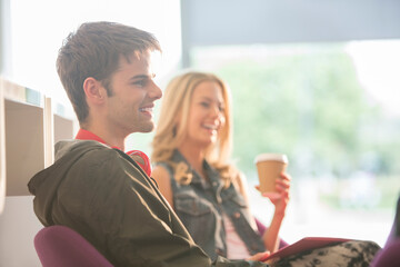University students laughing in lounge