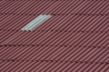 roof with new and old tiles