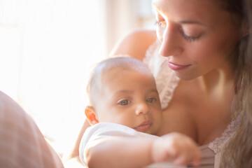 Obraz na płótnie Canvas Mother holding baby boy