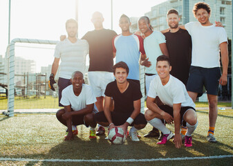 Soccer players smiling on field