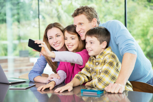 Family taking cell phone picture together