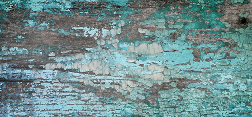 Old crackled painted wood surface. Vintage wooden wall or floor with cracked paint.
