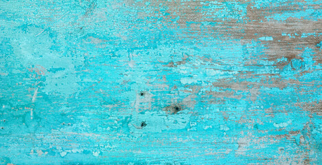 Fototapeta na wymiar Old crackled painted wood surface. Vintage wooden wall or floor with cracked paint.