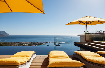 Lounge chairs overlooking infinity pool and ocean