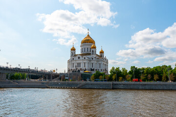 Fototapeta premium Cathedral of christ the savior in Moscow Russia, shot at bright summer day. Russian orthodox architecture style with golden top. 