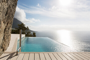 Modern swimming pool overlooking ocean