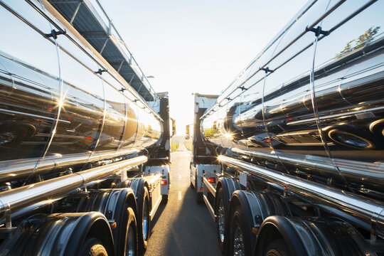 Stainless steel milk tankers side by side
