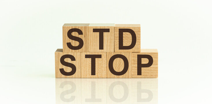 STOP STD Sexually transmitted infections text on wooden cubes. Medical concept