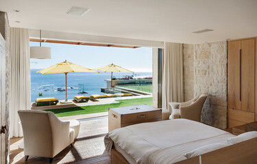 Bedroom overlooking patio and ocean