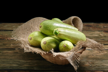 White zucchini on a wooden background, layout for a healthy diet and organic advertising of restaurant cooking