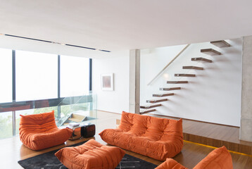 Sofas and staircase in modern living room