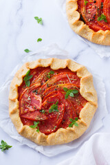 Homemade seasonal savoury summer tomato galette, tart, pie