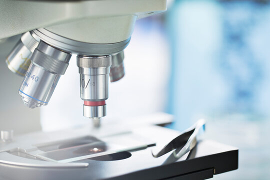 Close up of slide in microscope in lab