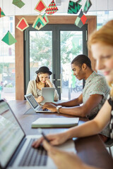 People working at conference table in office