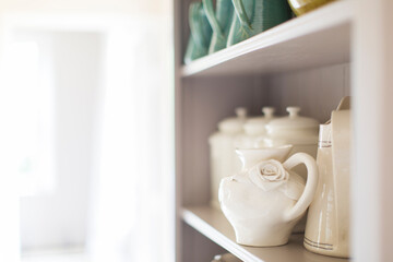 Fototapeta na wymiar Close up of ceramics on kitchen shelf