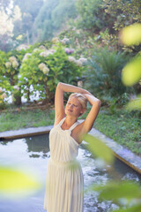 Naklejka premium Woman standing by pool outdoors