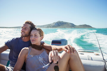 Couple sitting on boat together - Powered by Adobe