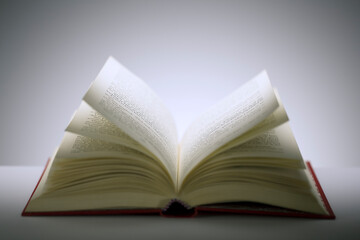 Close up of open book on counter