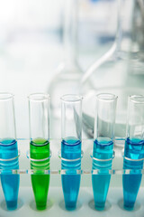 Rack of test tubes with solution on counter in lab