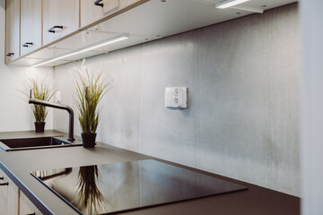 Modern countertop in a white kitchen with led backlight.