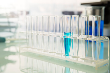 Rack of test tubes with solution on counter in lab