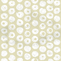 Seamless pattern of white circles painted on beige paper
