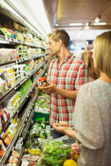 Couple shopping together in grocery store
