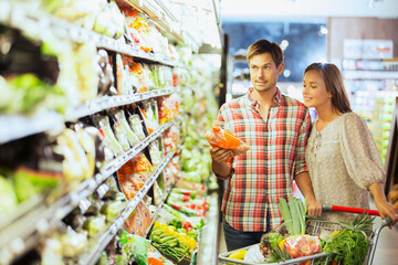 Couple shopping together in grocery store