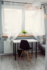 Bright interior of a modern student room at home, creative worker, interior design. Minimalistic workplace