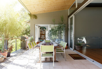 Dining table and chairs in sunny patio