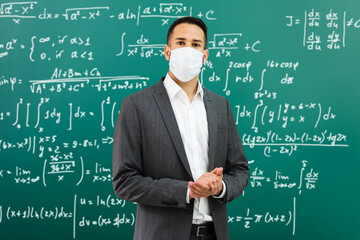 University Professor Standing In Class