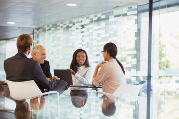Business people talking in meeting in office building