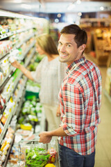 Couple shopping together in grocery store