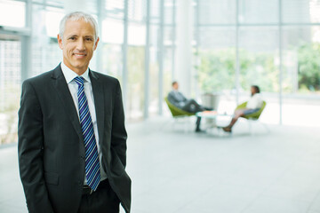Businessman smiling in office building
