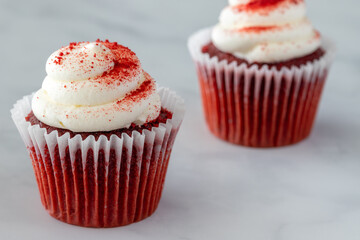 Two Red Velvet Cupcakes on Marble