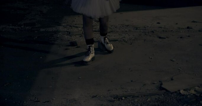 Female Dressed as Scary Clown Dancing in Front of Graffiti Walls